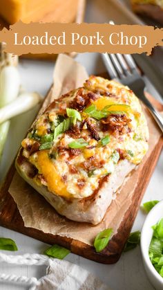 loaded pork chop on a cutting board with lettuce