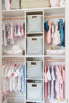 an organized closet with baskets and clothes hanging on the wall, including baby's ones