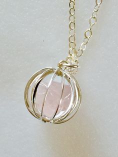 "Lovely gemstone necklace featuring gentle pink polished raw rose quartz nuggets captured inside darling 15 mm vintage cage in plated Sterling silver and suspended from delicate sparkling Sterling silver cable chain with matching spring ring clasp. Necklace available in 16\", 18\", or 20\" lengths. Also available on Sterling silver plated chain with matching lobster claw clasp. Both are lovely. Rose quartz is often called \"Love Stone\". It's energy opens the heart to unconditional love. It is a Paris Charm Bracelet, Lapis Necklace, Raw Rose Quartz, Rose Quartz Necklace, Clasp Necklace, Necklace Rose, Custom Bracelets, Quartz Necklace, Necklace Sterling Silver