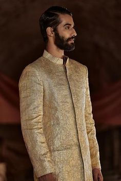 God textured lampi sherwani with chanderi organza kurta and striped lycra pants. Gold Sherwani Groom, Gold Sherwani, Sherwani Jacket, Organza Kurta, Blouse Yoke, Sherwani Groom, Nehru Jacket, Pants Fabric, Traditional Fashion