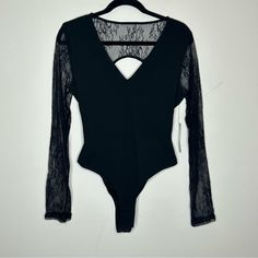 Brand New With Tag! Lulu's Black Lace Bodysuit Long Sleeve No Size Tag But Would Guess A Size Large For That Tighter Fit (Please Double Check Measurements Below For Perfect Fit) Measures Approx. 18.5“ Under Arm To Under Arm (37" Around) X 27.5“ Top Shoulder To Bottom Hem. Comes From A Clean And Smoke Free Home! Gold Bodysuit, Asymmetric Bodysuit, Strap Bodysuit, Sequin Bodysuit, Black Lace Bodysuit, Mock Neck Bodysuit, Olive Green Shorts, Floral Bodysuit, V Neck Bodysuit