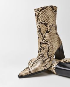 These boots were made for completing your fall looks Fall Snake Print Ankle Boots, Leather Snake Print Heeled Boots With Pointed Toe, Snake Print Leather Heeled Boots With Pointed Toe, Fall Leather Heeled Boots With Snake Print, Leather Heeled Boots With Snake Print For Fall, Leather Boots With Snake Print For Spring, Snake Print Heeled Boots With Round Toe For Fall, Fall Round Toe Heeled Boots With Snake Print, Fall Snake Print Heeled Boots With Round Toe