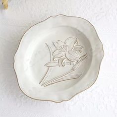 a white plate with an image of a bird on it