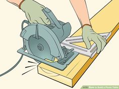 a person using a circular saw to cut wood