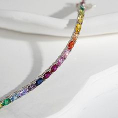 Radiance by Absolute™ Oval Stone Rainbow Tennis Bracelet There's no end to the rainbow of styling possibilities you'll discover in this line bracelet. Lots of sparkling, simulated diamond color make the spirited design such a vibrant and versatile look. Wear the piece as a statement single. Wear it as a stacking layer. Either way, it's a fab choice for special days or any day.        Approx. 6.75"L, 7.25"L or 8"L x 1/8"W      Stamped .925 sterling silver; platinum plating; polished finish      B Elegant Rainbow Round Bracelets, Elegant Rainbow Multi-stone Bracelets, Elegant Rainbow Jewelry With Sparkling Stones, Rainbow Colored Oval Jewelry, Elegant Adjustable Rainbow Bracelet, Diamond Wallpaper, Signature Jewelry, Oval Stone, Diamond Color