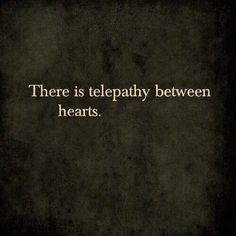 there is telepathy between hearts quote on black and white background with gold lettering