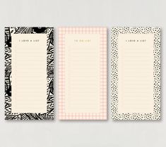 two blank notepads with black and white designs on them, one has a pink checkered border