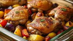 chicken and vegetables in a glass dish on a table