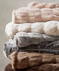 a stack of blankets sitting on top of each other