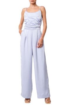 This party-ready jumpsuit is styled with a pleated bodice and finished with wide legs and handy pockets. 53" center front length; 30" inseam; 24" leg opening (size Medium) Scoop neck Adjustable straps Front slant pockets Lined 100% polyester Hand wash, line dry Imported Asian Owned/Founded Spring Evening Satin Jumpsuits And Rompers, Chic Spring Satin Jumpsuits And Rompers, Elegant High Waist Strapless Jumpsuit For Spring, Elegant High-waist Strapless Jumpsuit For Spring, Spring Evening Strapless Wide Leg Jumpsuit, Spring Satin Jumpsuit For Night Out, Satin Jumpsuits And Rompers For Night Out In Spring, Elegant Wide Leg Jumpsuits And Rompers With Pockets, Solid Color Party Jumpsuits And Rompers With Pockets