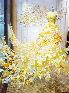 a dress made out of yellow and white butterflies