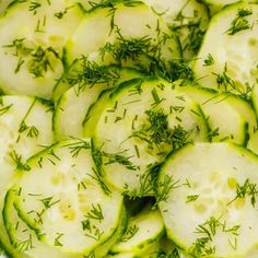 sliced cucumbers with dill and herbs on top