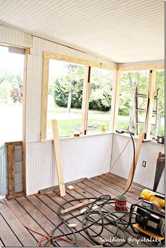 the inside of a house being remodeled with wood flooring and construction equipment in place