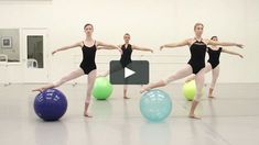 three women in black leotards are balancing on balls