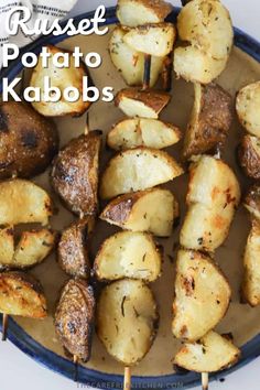 grilled potato kabobs on a plate with text overlay that reads, rassee potato kabobs