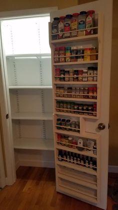 an open pantry door with shelves full of food