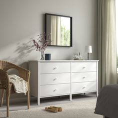 a bedroom scene with focus on the dresser