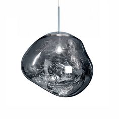 a glass light hanging from a ceiling fixture