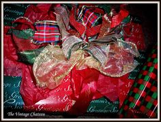 a pile of red, green and gold christmas ribbons on top of each other with words written across them