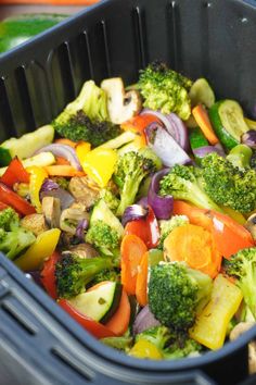 a plastic container filled with assorted veggies