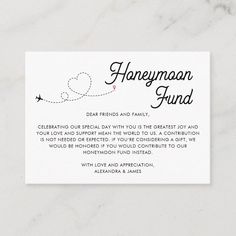 the honeymoon fund card is shown on a white marble surface with an airplane flying in the sky