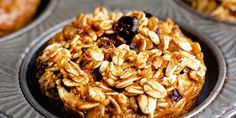 an oatmeal cookie with raisins on top in a muffin tin