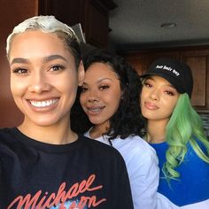 three women with green hair posing for a photo in front of a kitchen counter top