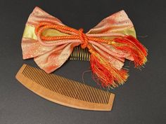 "This set of Kanzashi hair ornaments comes with one handmade kimono fabric ribbon Bow in red and gold and one Kushi comb with  traditional Japanese designs. *Fast shipping From US *Follow us for more, we update almost everyday Red and Gold Bow Ribbon/Kanoko dome -Approximate Size: L 7 1/4\"(18.5cm) ✕ W 3 1/4\" (48.5cm)✕ H 1 1/4\" (3.5cm) -Material: Fabric, Metal -Condition: In Excellent condition. Check photos/video  Long Kushi Comb/Kanzashi Kushi -Approximate Size: L 6\"(15.5cm) ✕ W 1 1/2\" (3. Kimono Geisha, Japan Hair, Japanese Designs, Comb Hair, Bow Ribbon, Kimono Fabric, Vintage Kimono, Fabric Ribbon, Japanese Design