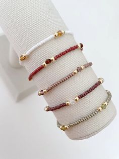 one seed bead stacking bracelet with 14k gold accent beads bracelets are made on a durable stretch elastic cord please refer to our sizing guide before purchasing Seed Bead And Crystal Bracelets, Trendy Beaded Bracelets Diy, Simple Bracelets Diy Beads, Small Buissnes Bracelet, Masculine Beaded Bracelets, String And Bead Bracelets, Stack Bracelets Beaded, Dainty Beaded Jewelry, Simple Seed Bead Bracelets