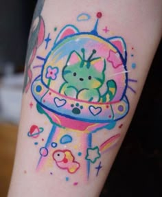 a colorful tattoo on the leg of a person with a cat in a space ship