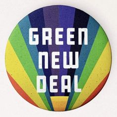 a button with the words green new deal on it