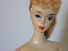 a doll with blonde hair and blue eyes