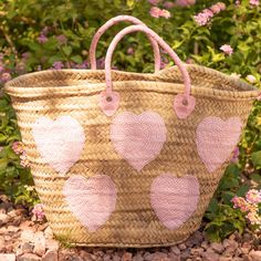 Handcrafted large straw bag with pink sequin hearts.This straw bag is hand woven with wicker palm straw sourced locally in Morocco. It has hand sewn pink sequins in the shape of hearts. The handles are genuine pink leather and are also handcrafted by Moroccan artisans. This bag has more than enough room for all your essentials! Use it as a beach bag, while running errands during the day, or even dress it up for a night on the town. This is the perfect fashion accessory to any outfit for any occa Pink Bucket Straw Bag With Braided Handles, Handmade Pink Straw Tote Bag, Pink Handwoven Bucket Straw Bag, Handmade Pink Bucket Straw Bag, Pink Woven Straw Tote Bag, Pink Handwoven Straw Bag, Pink Handwoven Straw Bag For Summer, Pink Straw Bag With Braided Handles, Kawaii Bags