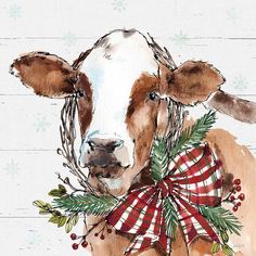 a brown and white cow with a red bow on it's neck is standing in front of snowflakes