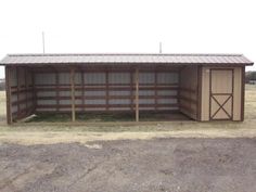 a large shed with two doors on the side