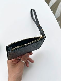 This slim and lightweight cardcase is an every day essential to throw in any bag or in your pocket. It features a 7” wristlet pull with metal pegs that open to accommodate your keys. The exterior has four dedicated card slots and the main zippered compartment holds additional cards and/or cash. Redefine your everyday carry with a touch of luxury and practical elegance. PLAY CARDCASE FEATURES Sustainable Up-cycled embossed leather 100% cotton twill lining 7" Wristlet pull with key slot 4 Exterior Versatile Coin Purse With Card Slots For On-the-go, Trendy Rectangular Card Holder With Zipper Closure, Modern Travel Card Holder With Zipper Closure, Modern Coin Purse With Card Slots For On-the-go, Versatile Card Holder With Zipper Closure, Modern Card Holder With Zipper Closure For Daily Use, Travel Card Holder With Zipper Closure, Travel Rectangular Card Holder With Zipper Closure, Versatile Card Holder With Zipper Closure For Daily Use