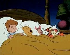 an animated image of a boy sleeping in bed with winnie the pooh and tigger