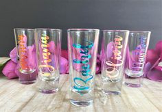 four personalized tumblers sitting on a table