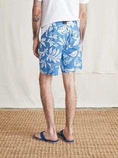 Surfrider Sunwashed Boardshort - Sky Floral | Faherty Brand Casual Blue Recycled Polyester Bottoms, Casual Blue Bottoms In Recycled Polyester, Recycled Polyester Shorts For Summer, Recycled Polyester Summer Shorts, Summer Bottoms With Elastic Waistband In Recycled Polyester, Recycled Polyester Swim Trunks For Beach, Relaxed Fit Surfing Shorts With Elastic Waistband, Recycled Polyester Beach Bottoms, Recycled Polyester Short Swimwear For Beach