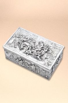 an ornately decorated box on a beige background