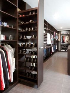 an image of a closet with shoes and clothes on shelves in the middle of it