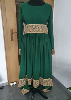 Green Afghan costume with matching trousers and train, Nikkah Formal Bollywood Green Sharara, Bollywood Style Green Sharara For Formal Occasions, Green Bollywood Style Sharara For Formal Occasions, Traditional Formal Full-length Sets, Traditional Formal Full Length Sets, Floor-length Dresses With Dabka Work For Formal Occasions, Traditional Drape Maxi Dress For Eid Party, Traditional Formal Maxi Length Lehenga, Traditional Drape Fitted Dresses With Pallu