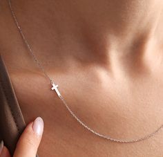 100% 925K Solid Sterling silver 100% Hand Made Adjustable: 2-inch Extension Chain Thickness: 1.1 mm 💖 Embrace the grace of this incredibly delicate and elegant solid silver sideways cross necklace designed for women, offering a sense of protection from the divine. Keep your faith intimately close to your heart with this beautiful cross pendant. This 925 sterling silver cross necklace features a minimalist and delicate gold cross design, making it an ideal Christmas Gift, Mother's Day gift, Valentine's Day Gift, birthday gift for her, a thoughtful gift for granny, children, or a meaningful Graduation Gift. The personalized cross necklace boasts a tiny sideway silver cross charm, making it the perfect gift for Mom. It's an all-silver piece that exudes simplicity and sophistication. 💖 FEATU Cheap Cross Necklace For Women As A Gift, Meaningful Graduation Gifts, Sideways Cross Necklace, Dainty Cross Necklace, Personalized Cross Necklace, Cross Necklace Sideways, Cross Necklaces, Silver Cross Necklace, Sterling Silver Cross Necklace