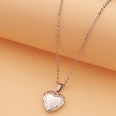 Adorn your neckline with a heart locket pendant necklace, elegantly crafted in gold-plated stainless steel for a timeless and sentimental accessory. Material: Stainless Steel 18k Gold plated Chain length: 40cm+ 5cm/ 16"+2" Pendant: 22mm / 0.9" Weight: 7g Timeframes may be extended during the lead up to the peak holiday season, so please get your orders in early. All individual items will be shipped separately within each order.We will contact you if we require any clarification or further details for your order. Order a Love Locket Necklac today and surprise your loved ones with a secret message they can cherish forever ❤ Rose Gold Heart Charm Pendant Locket Necklace, Rose Gold Heart Charm Locket Necklace, Rose Gold Metal Heart Necklace For Anniversary, Anniversary Rose Gold Heart Necklace, Rose Gold Heart Charm Necklace For Keepsake, Rose Gold Heart Charm Necklace As Keepsake, Rose Gold Heart Pendant Locket Necklace, Rose Gold Stainless Steel Heart Pendant Jewelry, Rose Gold Heart Locket Necklace