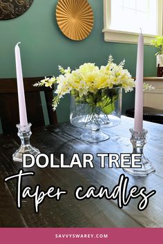 dollar tree taper candles are sitting on a dining room table with flowers in the center