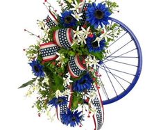 a bouquet of flowers in the shape of a wheel with stars and stripes on it