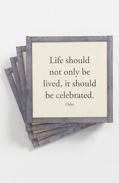 four coasters with a quote on them sitting next to each other, one saying life should not only be lived, it should be celebrated