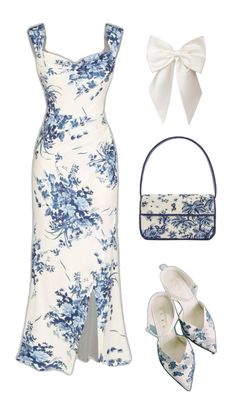 a white dress with blue and white flowers on it is next to a handbag