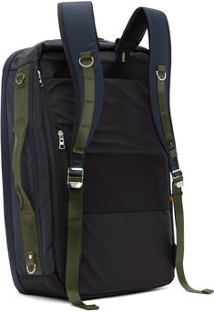 Waterproof MASTERTEX-07™️ CORDURA® ballistic nylon canvas backpack in navy. · Grained leather trim and D-rings throughout · Padded carry handle at top · Adjustable padded shoulder straps · Zip pockets and cinch straps at face · Leather logo patch · Patch pocket and carry handle at side · Laptop compartment at padded back face · Zip pocket and luggage strap · Two-way zip closure · Zip pockets at interior · Canvas lining · H21 x W14 x D4.5 Supplier color: Navy Functional Nylon Backpack With Detachable Strap, Nylon Backpack With Detachable Strap For Commuting, Functional Backpack With Detachable Strap For Outdoor, Navy Nylon Backpack, Functional Backpack With Detachable Strap, Daypack Backpack, Fringed Belt, Luggage Strap, Chain Strap Bag