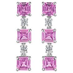 • 18KT White Gold • 6.95 Carats • Sold as a pair (2 earrings in total) • Number of Round Diamonds: 4 • Carat Weight: 0.40ctw • Number of Asscher Cut Pink Sapphires: 6 • Carat Weight: 6.55ctw • This pair of earrings features 6 alternating asscher cut pink sapphires set alongside 4 additional white round brilliant cut diamonds. The stones are secured in an 18KT white gold prong setting and has a combining total weight of 6.95 carats. Each stone has been perfectly matched and meticulously set by hand in New York City. Round Diamond Earrings, Asscher Cut Diamond, 2 Earrings, Asscher Cut, Yellow Sapphire, Wedding Card, Round Brilliant Cut Diamond, Pink Sapphire, Earings Piercings